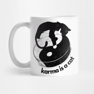 karma is a cat Mug